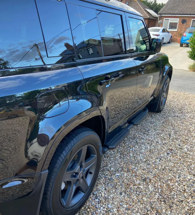 Reflective side finish on a black Land Rover Defender